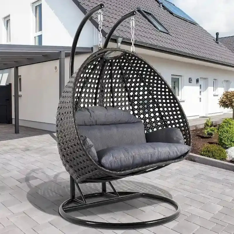 LeisureMod 2-Person Rattan Wicker Hanging Egg Chair With Stand and Cushioned Lounger