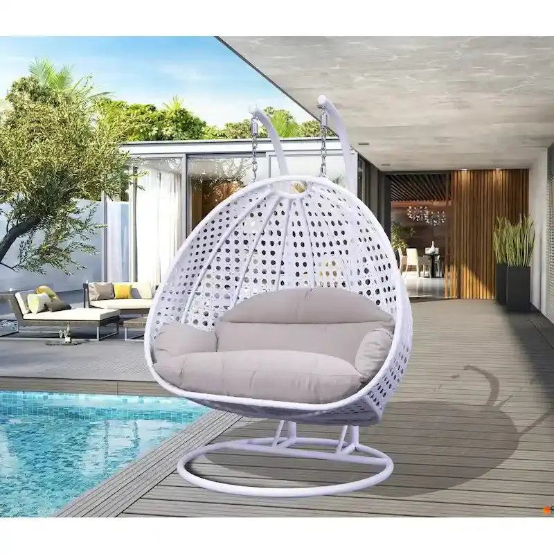 LeisureMod 2-Person Rattan Wicker Hanging Egg Chair With Stand and Cushioned Lounger